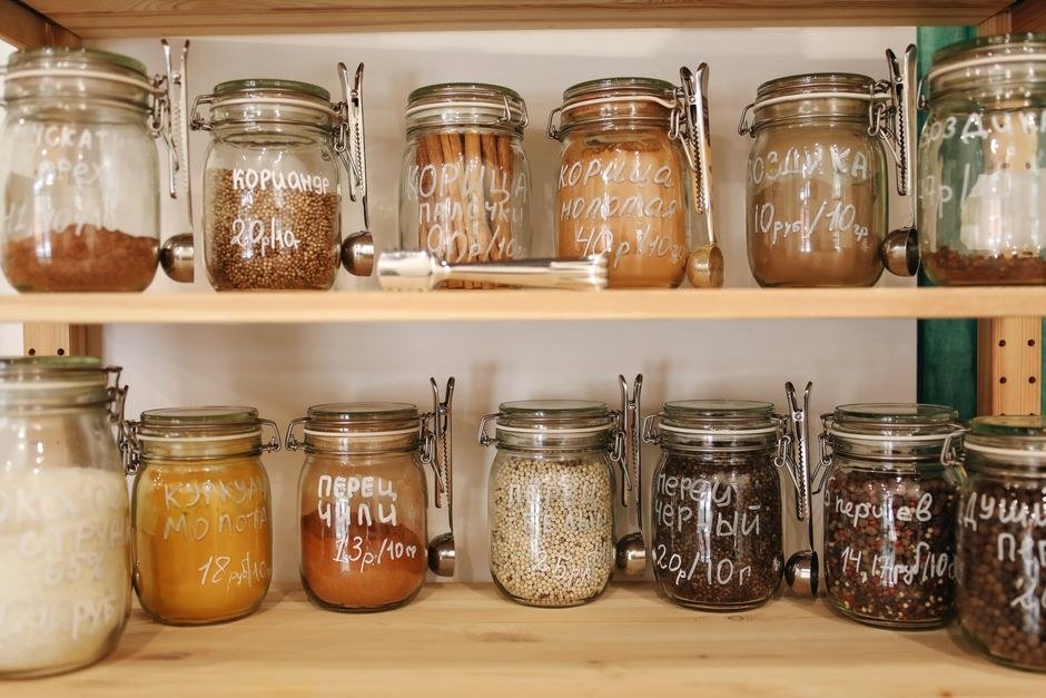 Organized pantry jars on open shelves